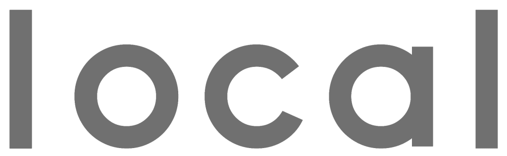 The word "local" is written in bold, lowercase, gray letters on a white background, evoking the look of a modern Print Advertising campaign.