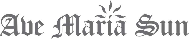 Logo for "Ave Maria Sun" in a decorative blackletter font, with a sunburst graphic above the letter "i" in "Maria," ideal for a premier media network specializing in both print advertising and modern outreach.